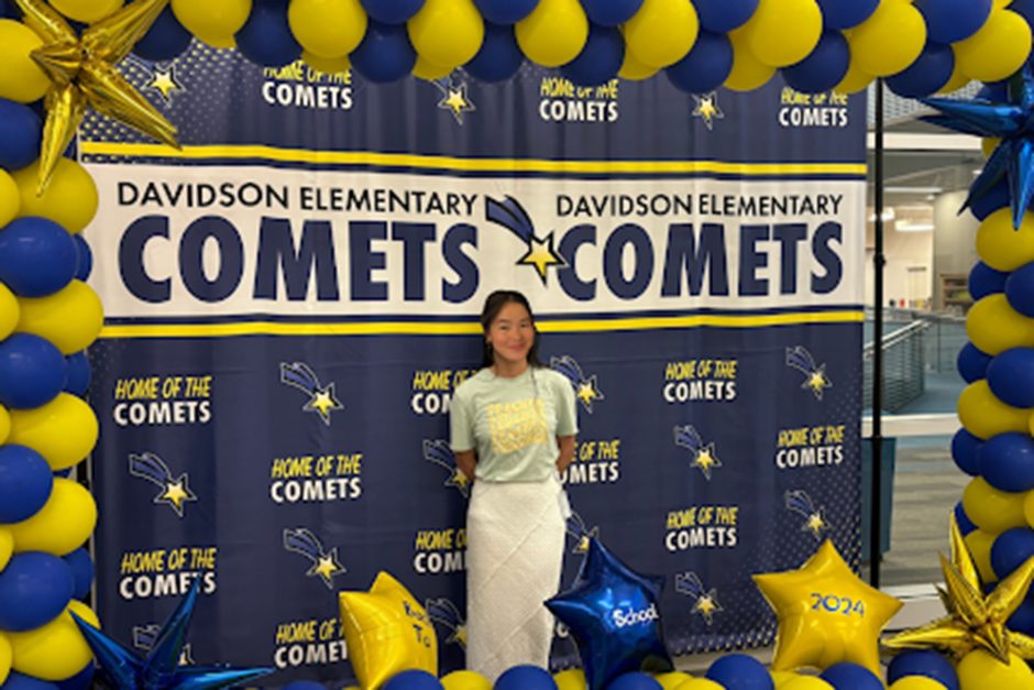 Cindy Nguyen with blue and yellow balloons