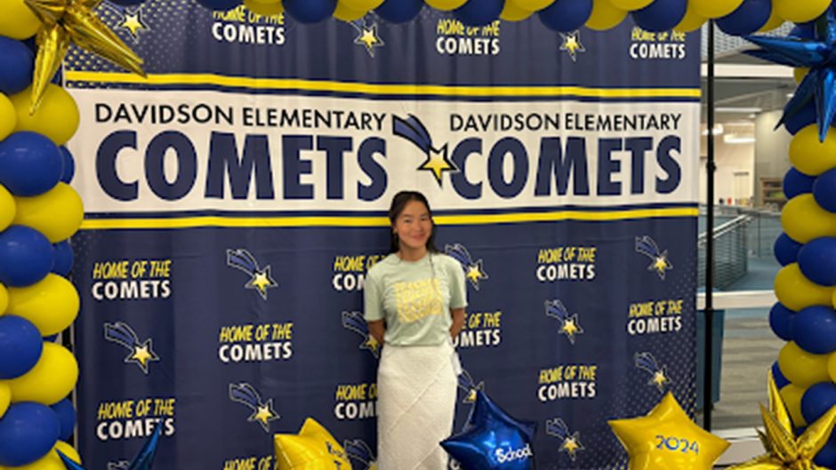 Cindy Nguyen with blue and yellow balloons