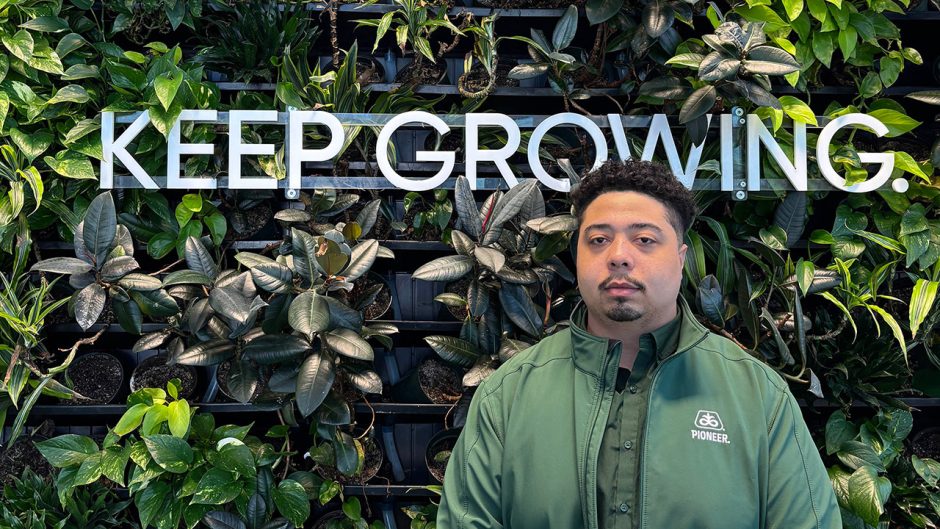 Isiah Massey in front of greenery