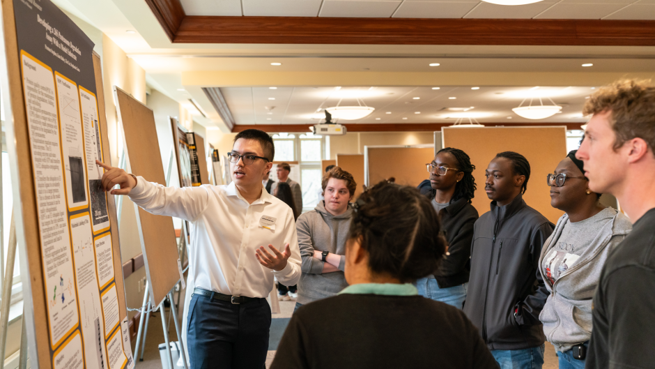Students look at poster