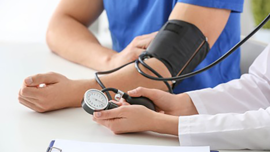 A person getting their blood pressure checked.