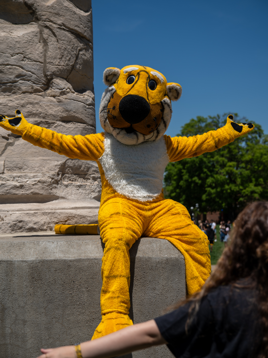 Truman the Tiger sits on Column